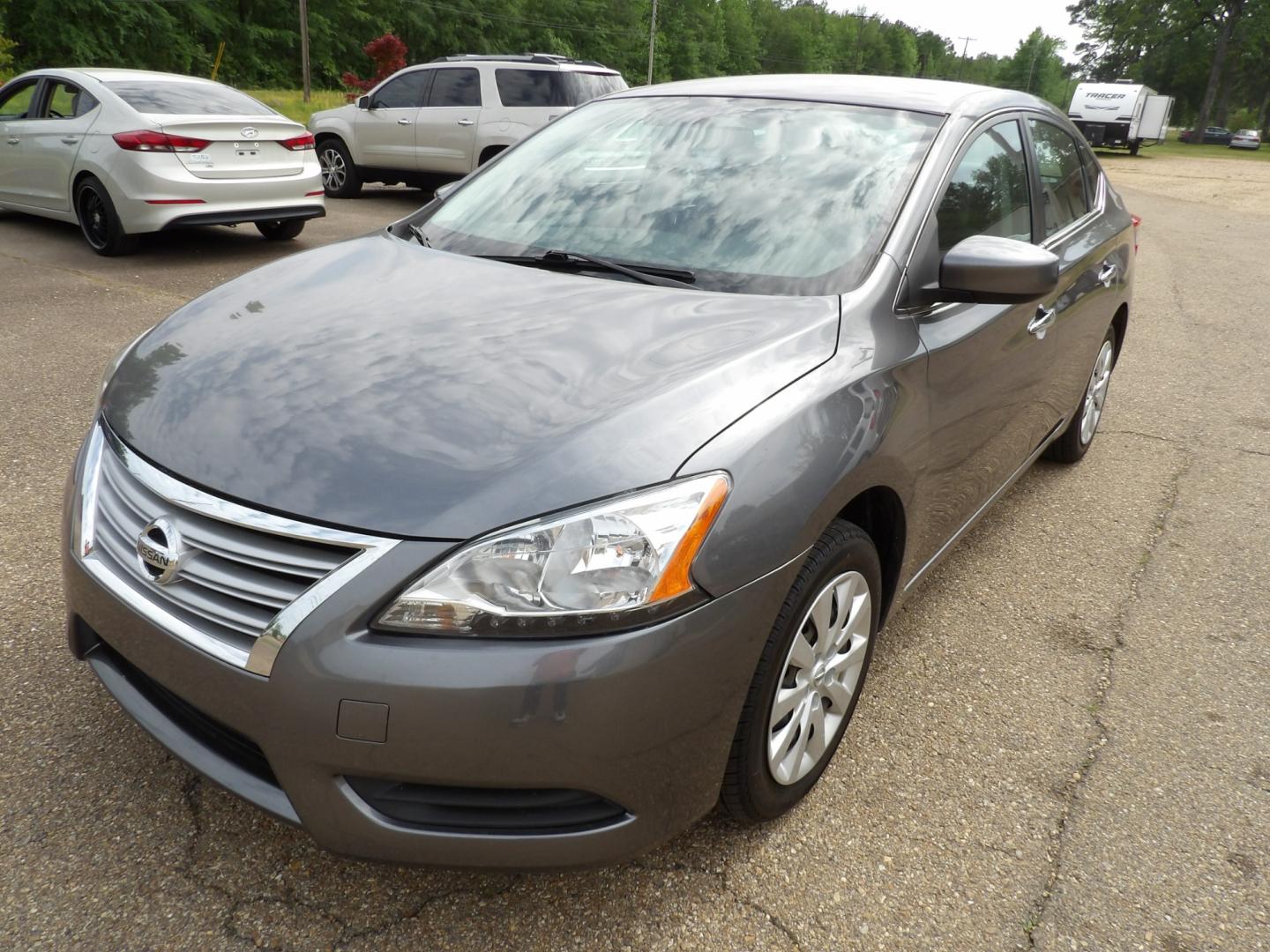 2015 Brilliant Silver /Black Nissan Sentra S 6MT (3N1AB7APXFY) with an 1.8L L4 SFI DOHC 16V engine, 6-Speed automatic transmission, located at 401 First NE, Bearden, AR, 71720, (870) 687-3414, 33.726528, -92.611519 - Photo#0