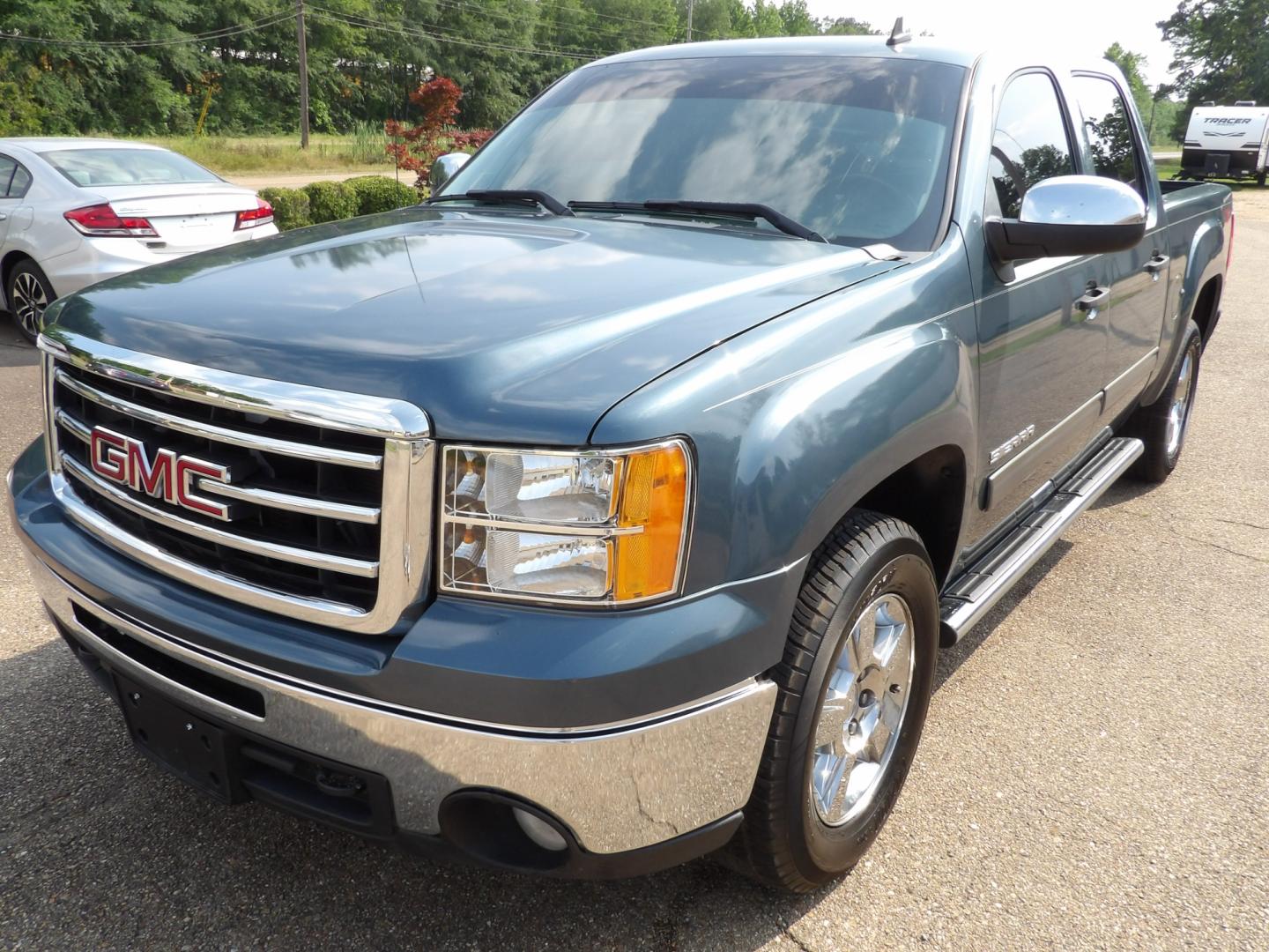 2012 Teal Blue Metallic /Black GMC Sierra 1500 SLE Crew Cab 2WD (3GTP1VE0XCG) with an 5.3L V8 OHV 16V FFV engine, 6-Speed Automatic transmission, located at 401 First NE, Bearden, AR, 71720, (870) 687-3414, 33.726528, -92.611519 - Photo#0