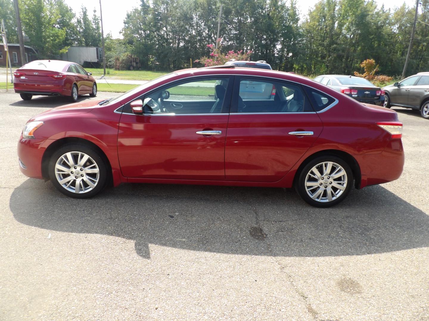 2014 Carmine Red Metallic /Black Nissan Sentra S 6MT (3N1AB7AP5EL) with an 1.8L L4 SFI DOHC 16V engine, 6-Speed Automatic transmission, located at 401 First NE, Bearden, AR, 71720, (870) 687-3414, 33.726528, -92.611519 - Photo#1