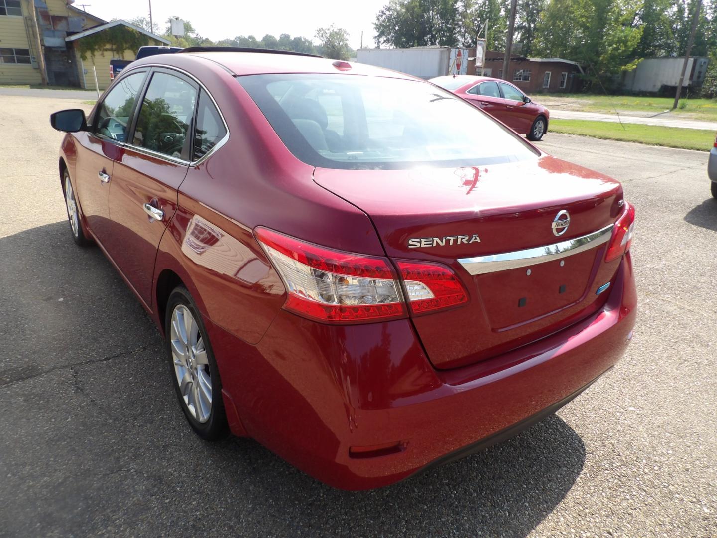 2014 Carmine Red Metallic /Black Nissan Sentra S 6MT (3N1AB7AP5EL) with an 1.8L L4 SFI DOHC 16V engine, 6-Speed Automatic transmission, located at 401 First NE, Bearden, AR, 71720, (870) 687-3414, 33.726528, -92.611519 - Photo#2