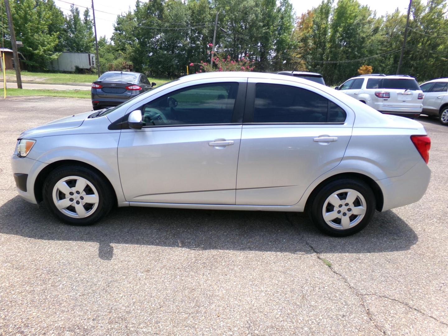 2015 /Gray Chevrolet Sonic LS Auto Sedan (1G1JA5SHXF4) with an 1.8L L4 DOHC 24V engine, 6-Speed Automatic transmission, located at 401 First NE, Bearden, AR, 71720, (870) 687-3414, 33.726528, -92.611519 - Photo#1