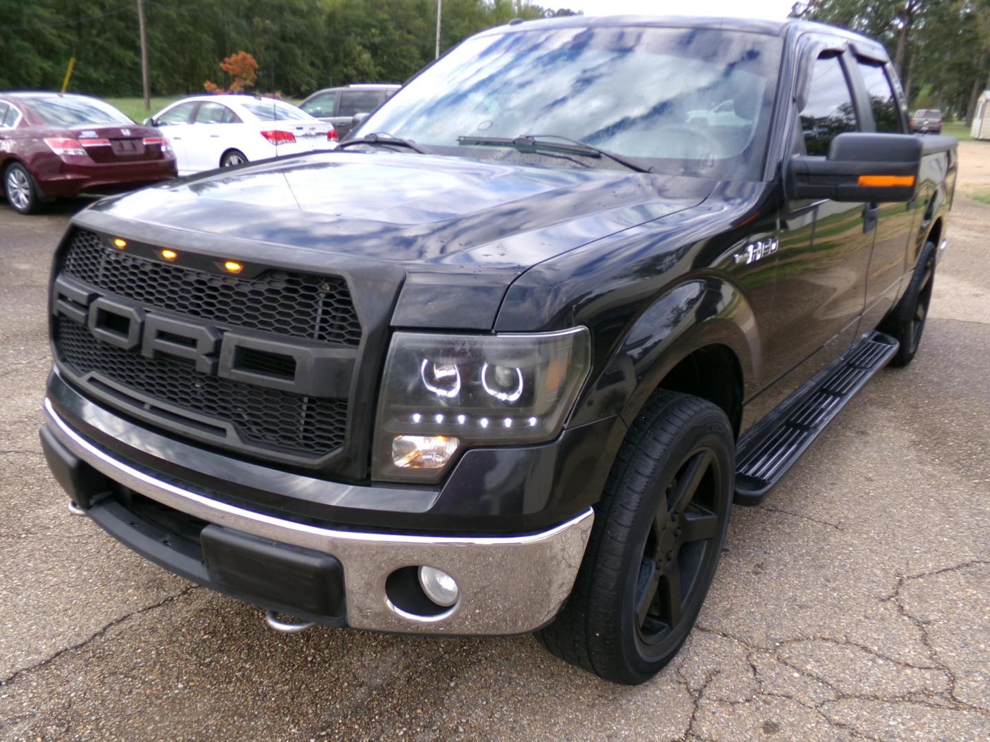 2010 Black /Tan Ford F-150 XLT SuperCrew 5.5-ft. Bed 2WD (1FTEW1C82AK) with an 4.6L V8 SOHC 24V engine, 4-Speed Automatic transmission, located at 401 First NE, Bearden, AR, 71720, (870) 687-3414, 33.726528, -92.611519 - Photo#0