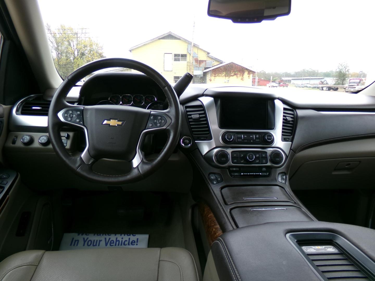 2015 Crystal Red Tintcoat /Tan Chevrolet Tahoe LTZ 4WD (1GNSKCKC1FR) with an 5.3L V8 OHV 16V engine, 6-Speed Automatic transmission, located at 401 First NE, Bearden, AR, 71720, (870) 687-3414, 33.726528, -92.611519 - Photo#24