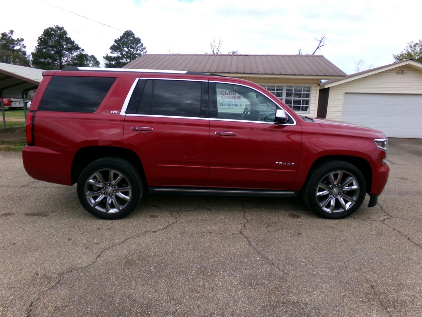 2015 Crystal Red Tintcoat /Tan Chevrolet Tahoe LTZ 4WD (1GNSKCKC1FR) with an 5.3L V8 OHV 16V engine, 6-Speed Automatic transmission, located at 401 First NE, Bearden, AR, 71720, (870) 687-3414, 33.726528, -92.611519 - Photo#26