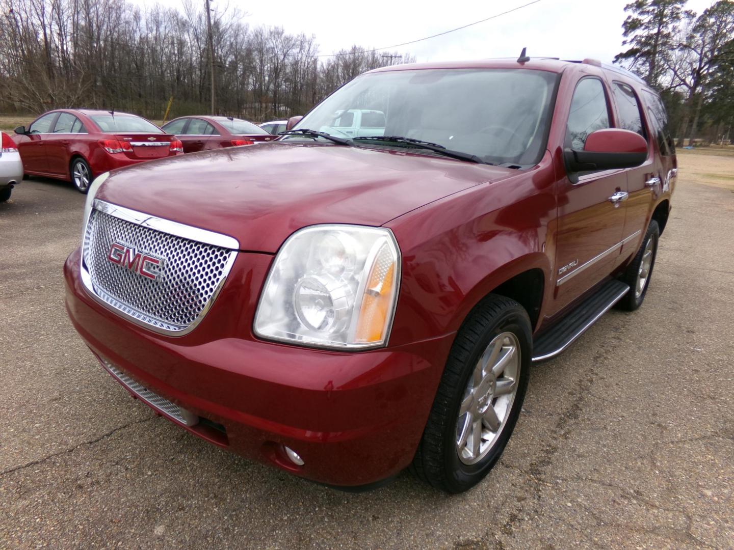 2010 Red Jewel Tintcoat /Tan GMC Yukon Denali 4WD (1GKUKEEF6AR) with an 6.2L V8 OHV 16V engine, 4-Speed Automatic transmission, located at 401 First NE, Bearden, AR, 71720, (870) 687-3414, 33.726528, -92.611519 - Photo#0